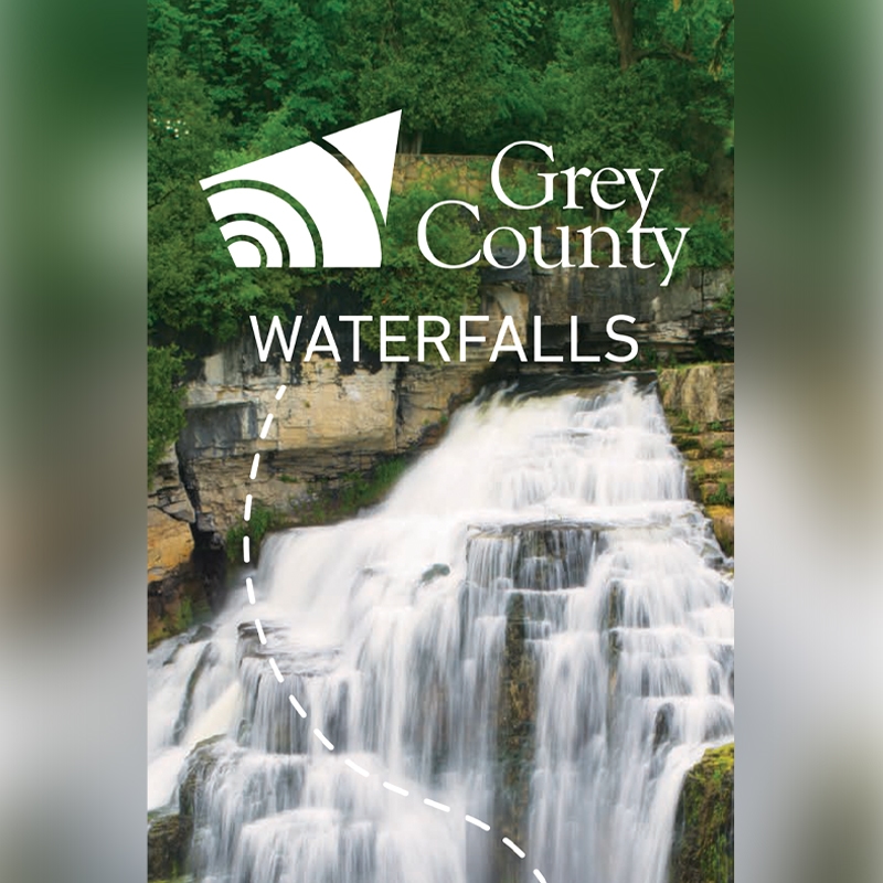 Cover of waterfalls map featuring long exposure image of water cascading down a waterfall.