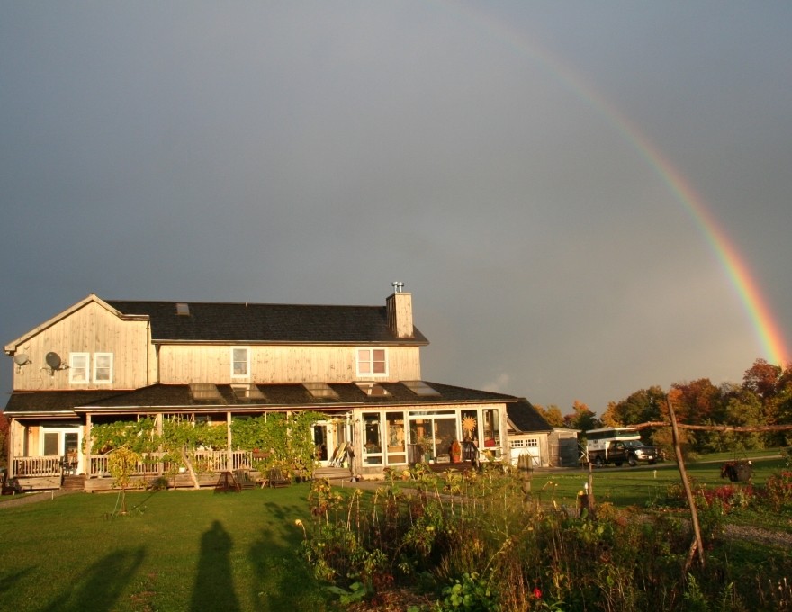 A building with a rainbow behind it