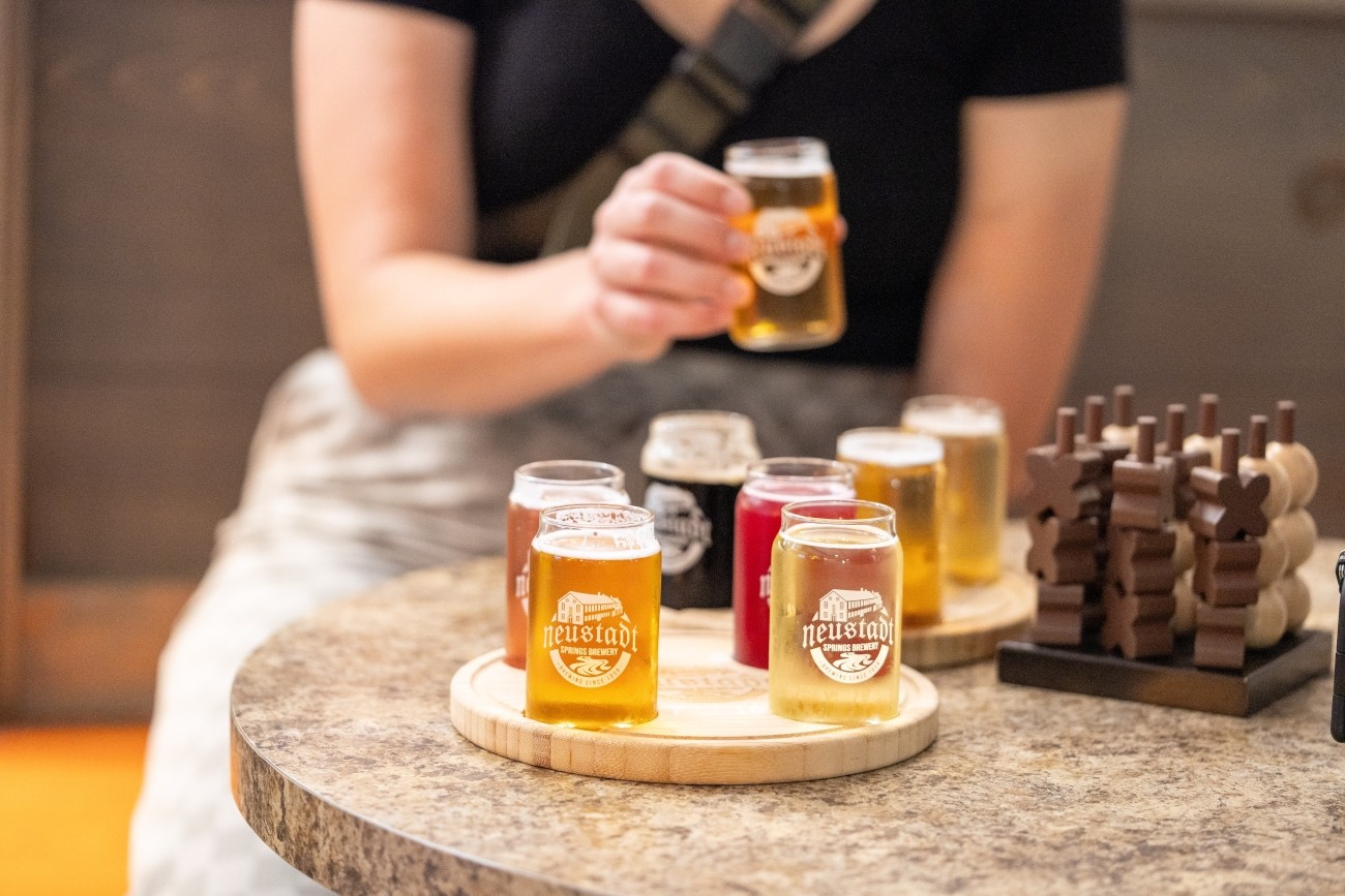 Sampling tray of several beers.,