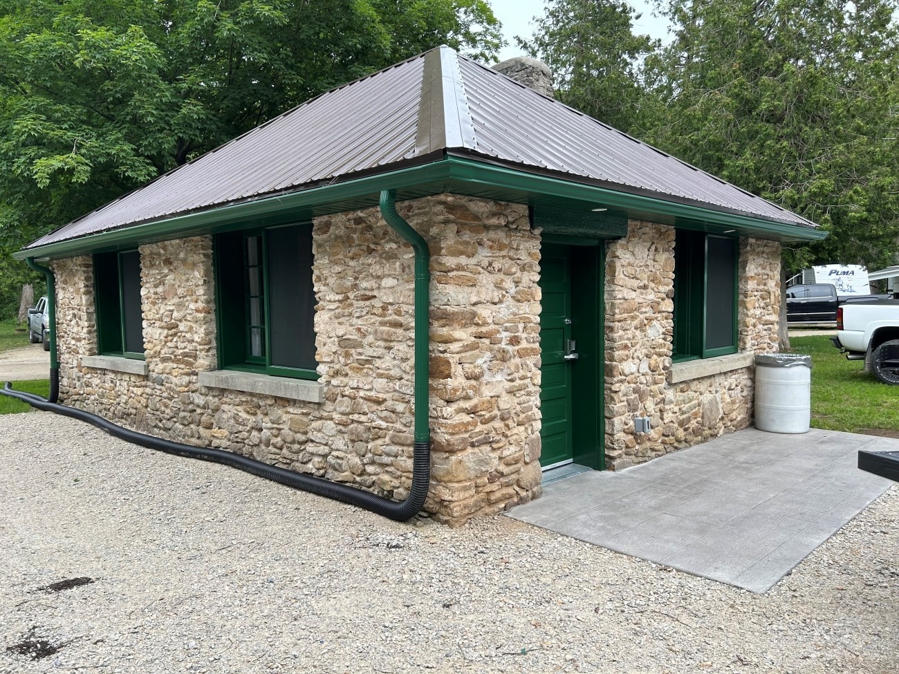 Exterior of a stone cabin.