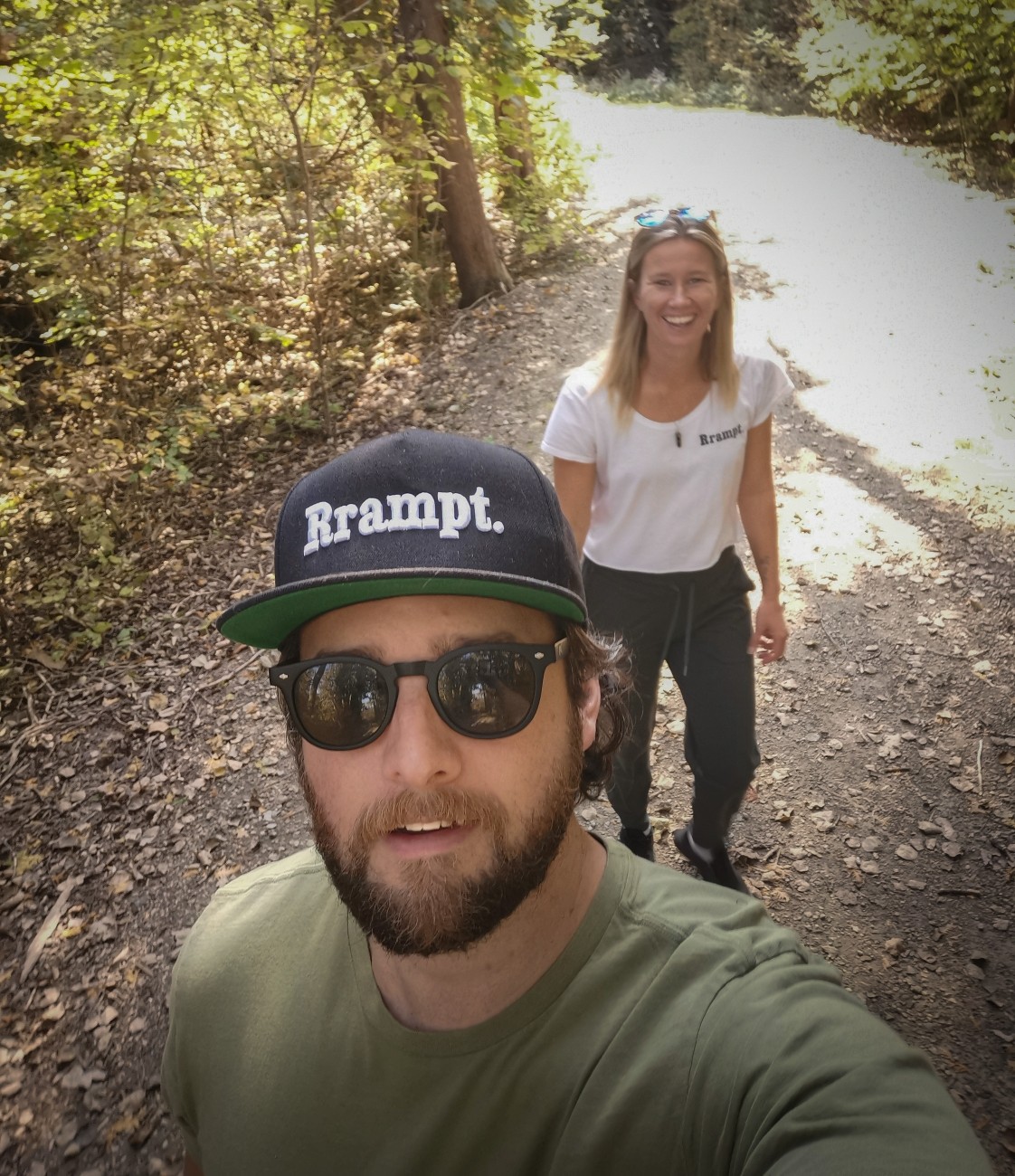 Selfie style photo of a bearded man and smiling woman.