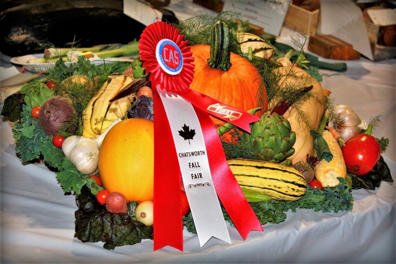 Selection of fresh produce bearing a red first place ribbon from the Chatsworth Fall Fair