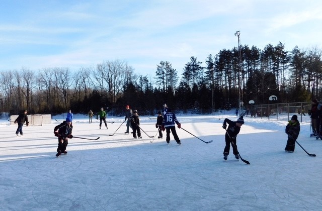 Hockey players on outdoor rink