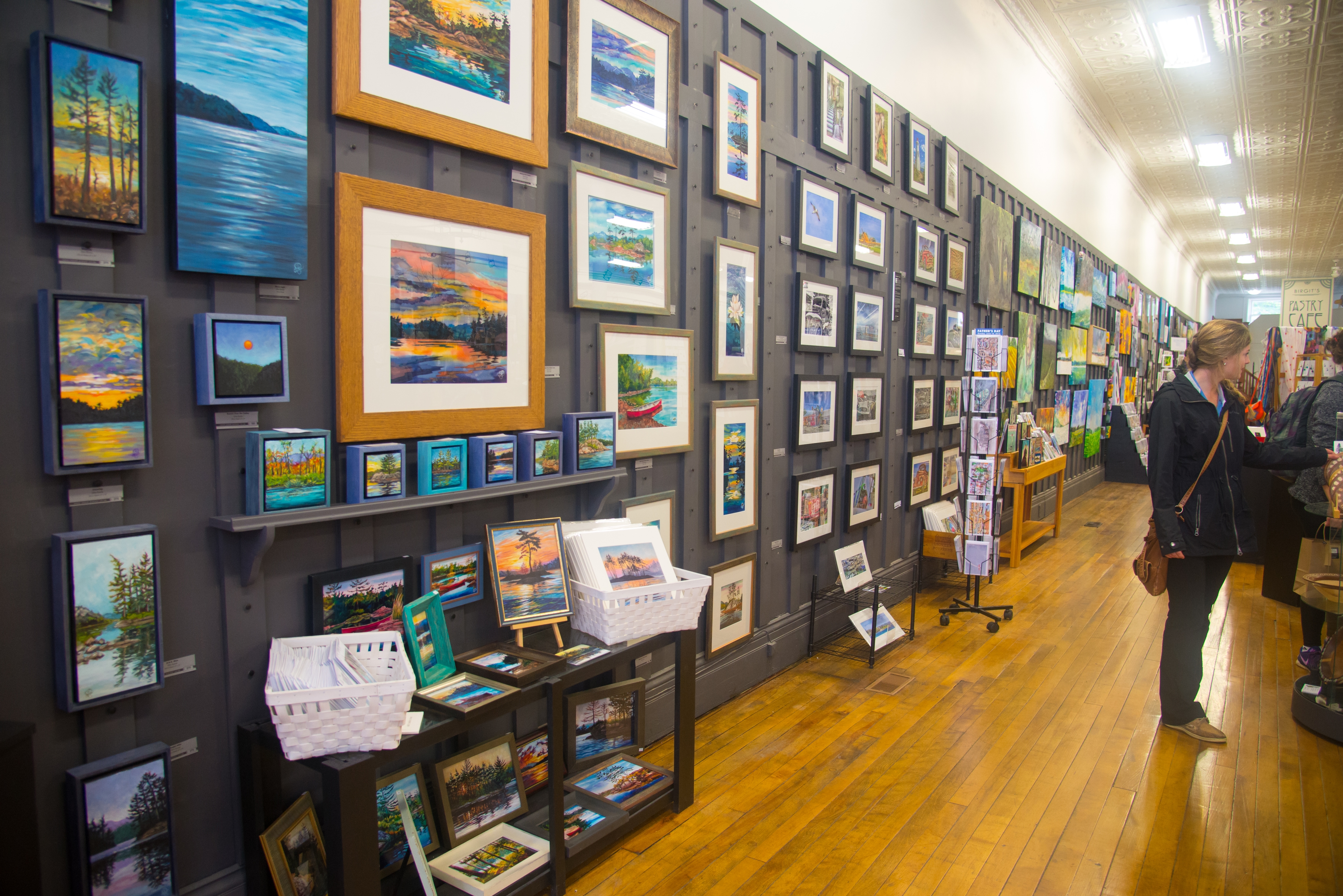 A wall of hanging art in the Artists' Co-op