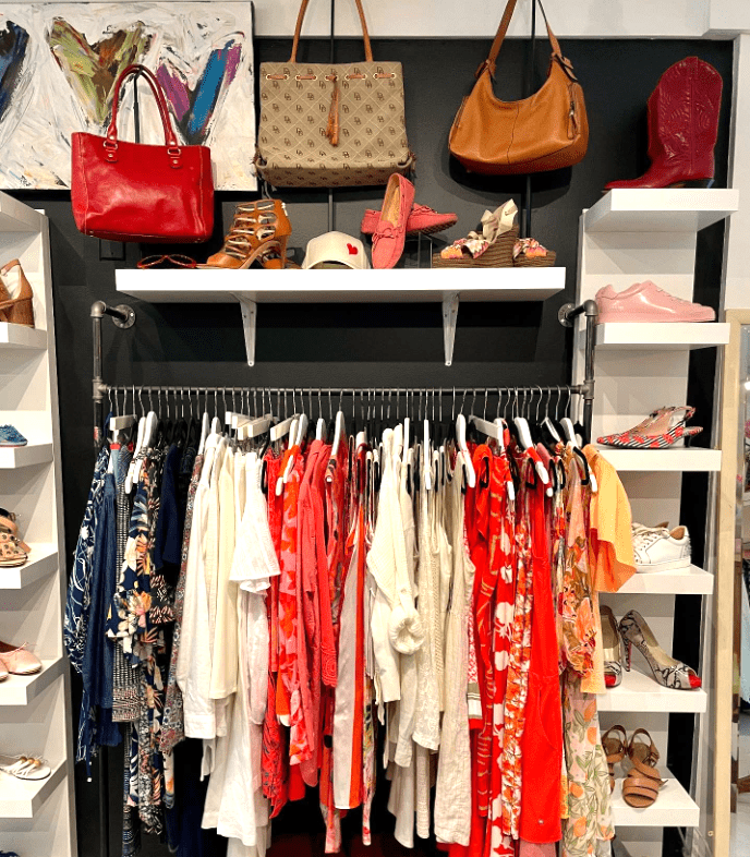 a rack of clothes in a boutique store