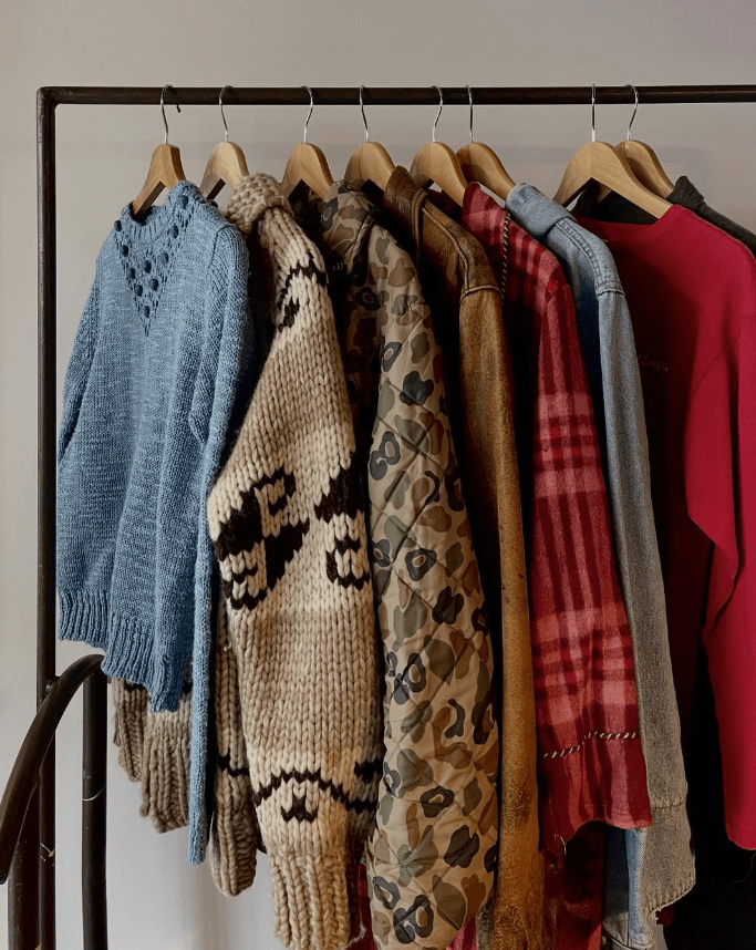 A rack of sweaters and jackets.